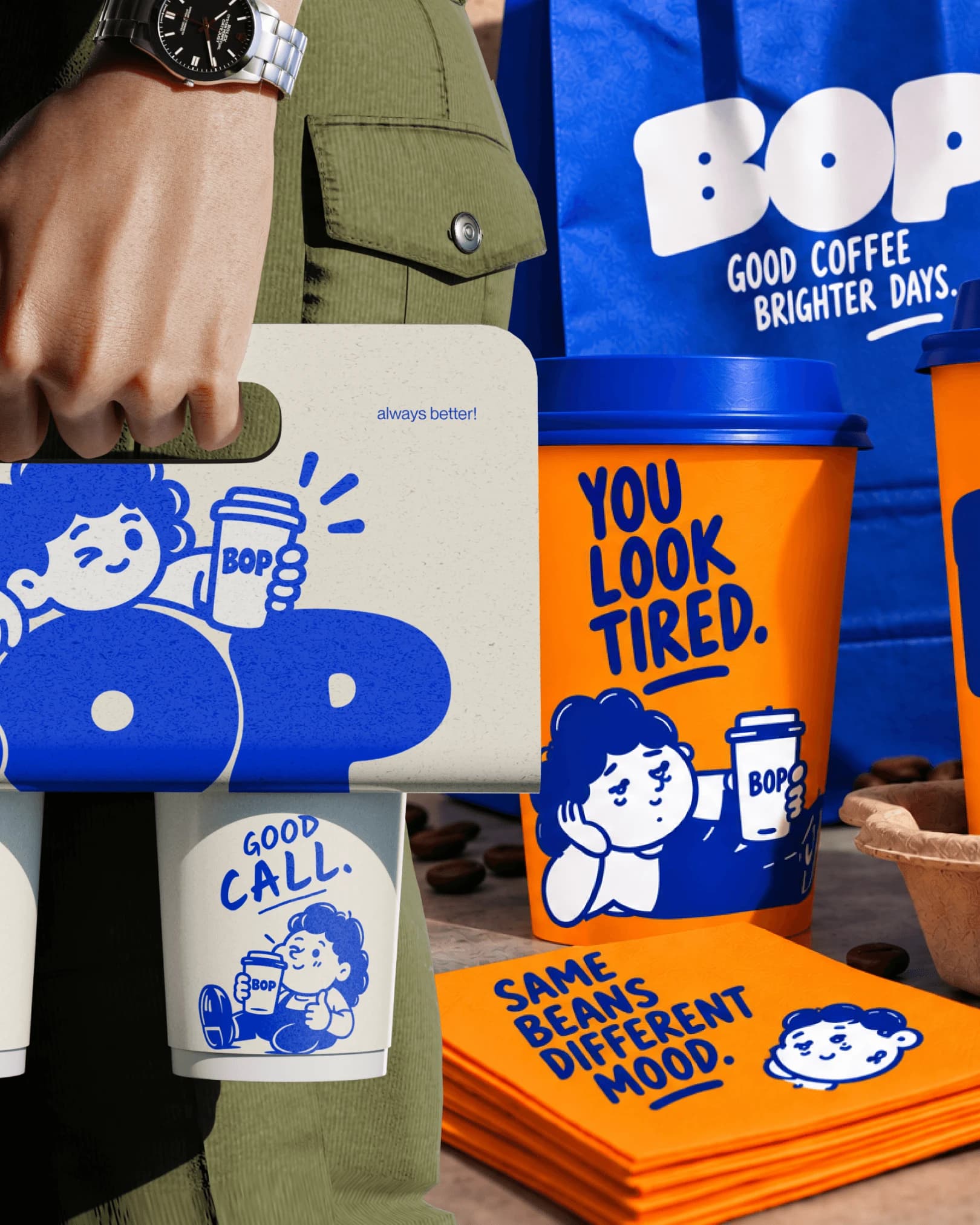 BOP coffee identity across a takeaway cup, branded bag and orange printed materials